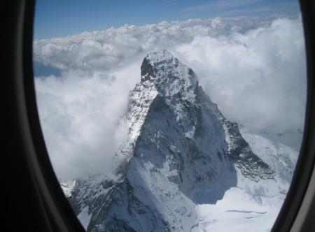 Magical view of the Alps from a window of the Cessna Citation Mustang.