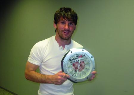 Leo Messi Argentine football player with the clock that he has signed for 