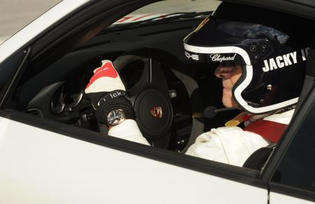 Jacky Ickx, with the Superfast Power Control model, in a Porsche. 