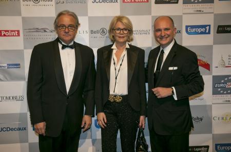 Rémy Depoix, President and organizer of the International Automobile Festival, and his wife with Carlos-A. Rosillo.