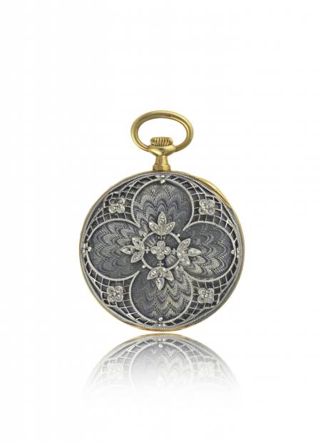 France 1909 - Lady's pendant watch, yellow gold, translucent enamel on guilloché back, platinum and diamond floral? pattern appliques. Silvered dial. 