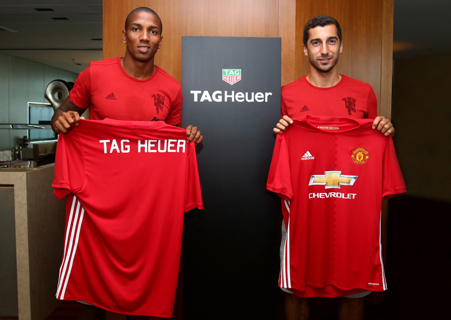 Ashley Young and Henrikh Mkhitaryan show off TAG Heuer branded jersey