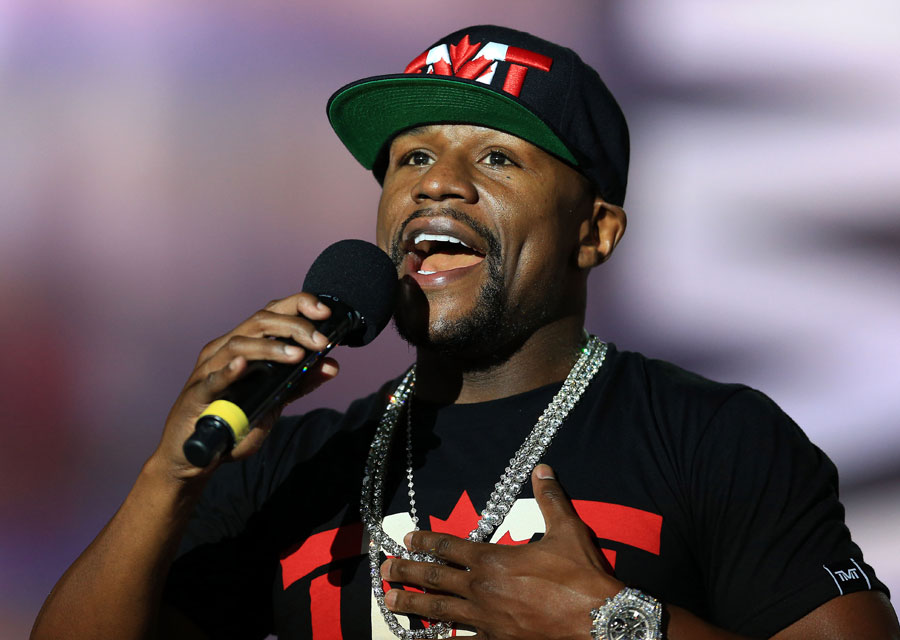 Floyd Mayweather at press conference, with a Hublot full paved watch on the wrist